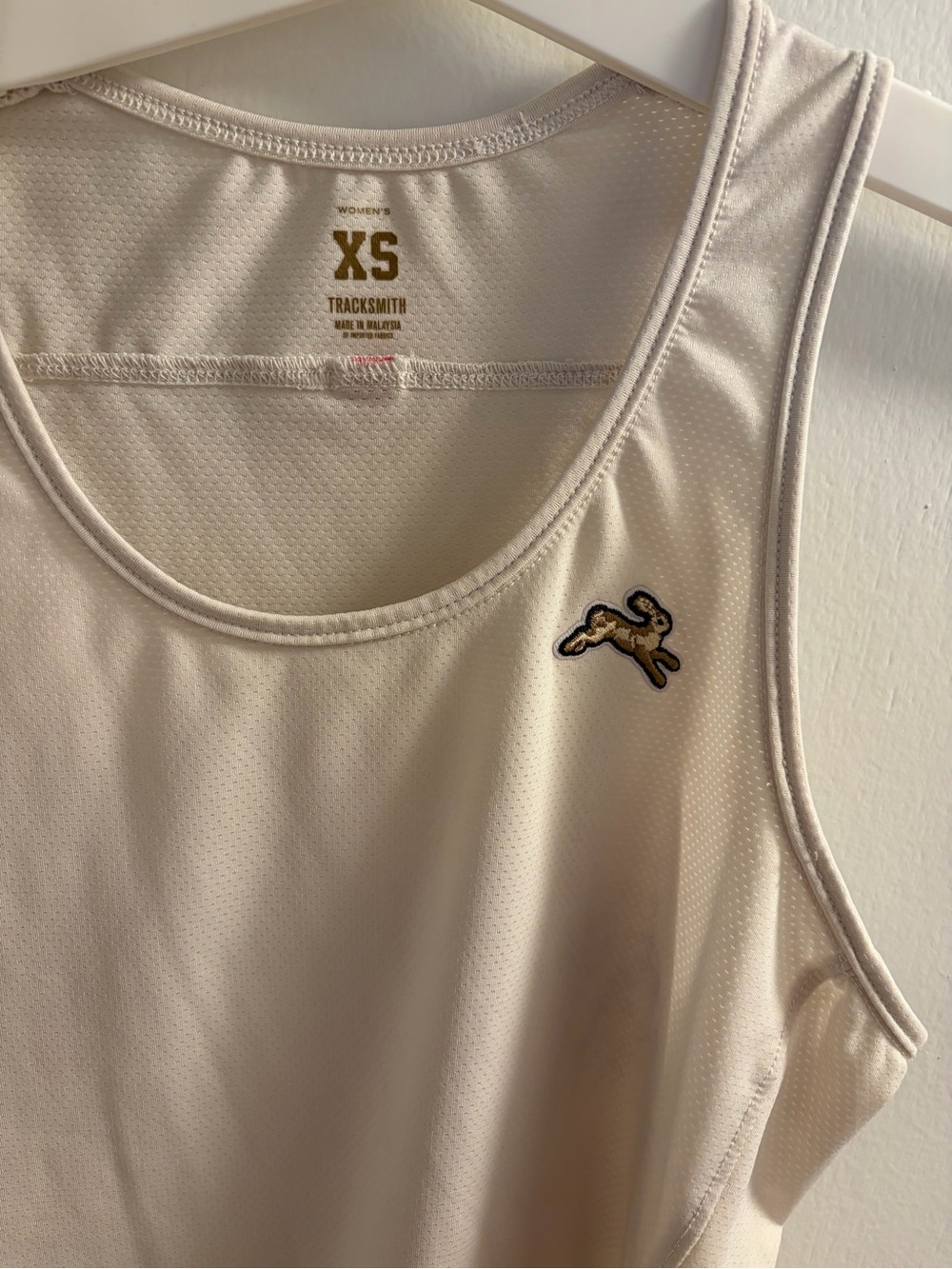 Tracksmith Cream Performance Tank with Rabbit Logo - Picture 2 of 11
